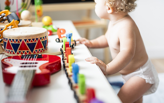 Male Toddler Playing with Toys
