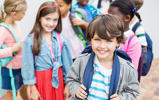 children with backpacks